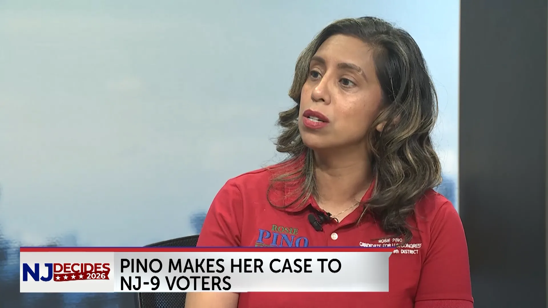 Rosie Pino, Republican candidate for New Jersey’s 9th Congressional District, speaks during a televised interview. A lower-third graphic reads, “Pino makes her case to NJ-9 voters,” alongside NJ Decides 2026 branding.