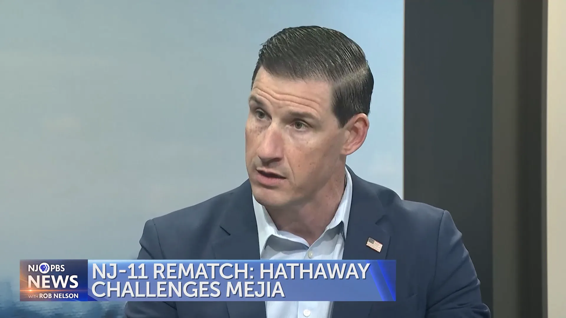 Joe Hathaway, a Republican candidate challenging Rep. Analilia Mejia in New Jersey’s 11th Congressional District, speaks during an interview on NJ PBS News with Rob Nelson. A lower-third graphic reads, “NJ-11 Rematch: Hathaway Challenges Mejia.”