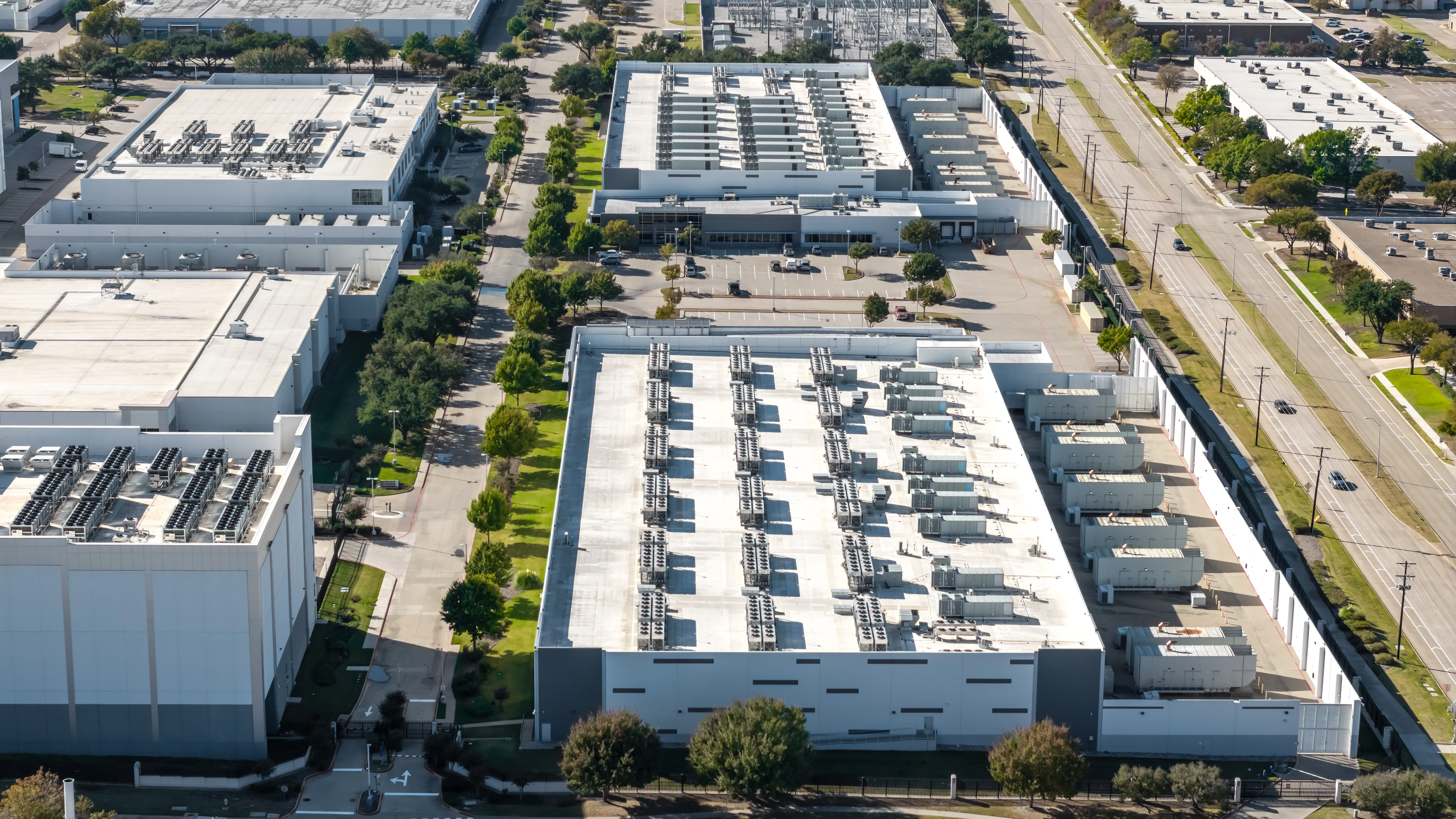 an aerial image of an ai data center exterior.